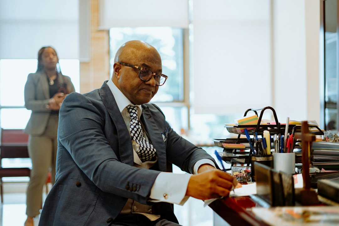 Attorney working at a desk in a law firm office, where an AI chatbot can handle after-hours enquiries